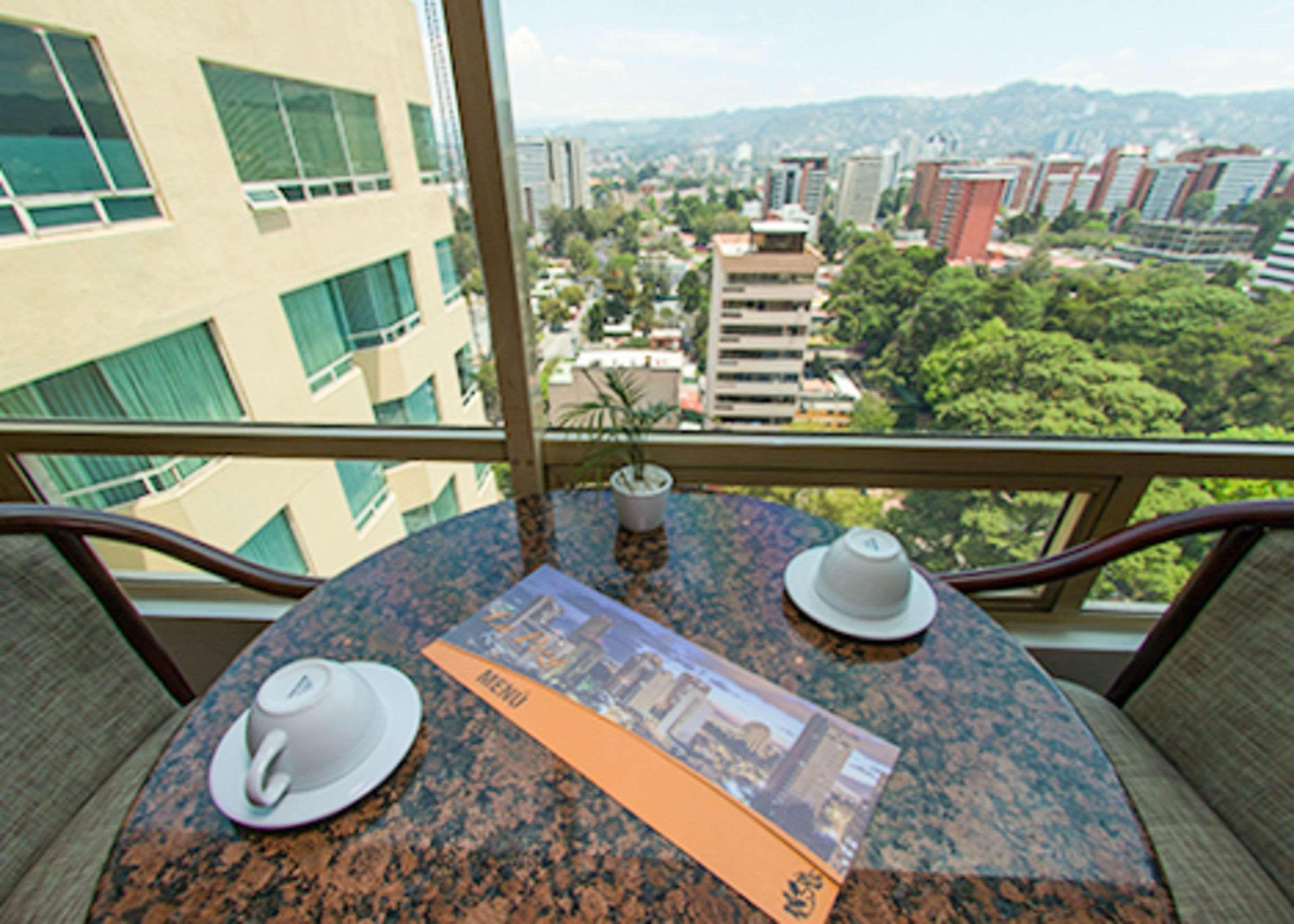 Clarion Suites Guatemala City Eksteriør bilde A view from a balcony